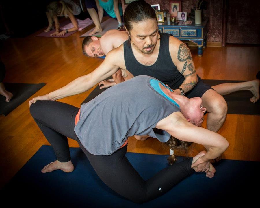 Mike Matsumura - Assisting drop back lunge pose Pranava Yoga Austin