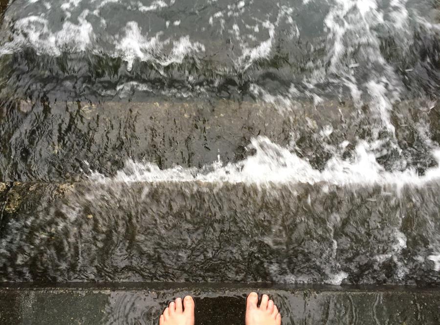 Feet in water stairs YA