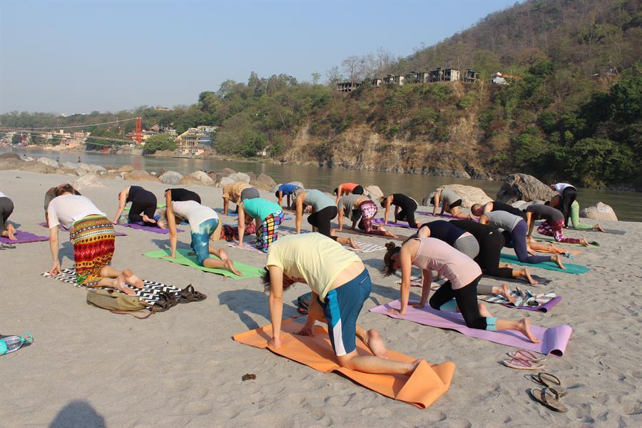 Morning yoga at beach in rishikesh