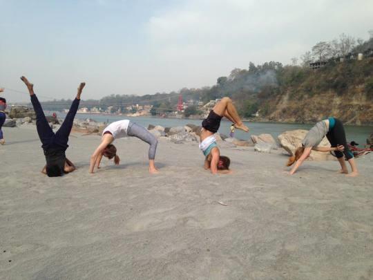 Amazing yoga poses near Ganges river in Rishikesh
