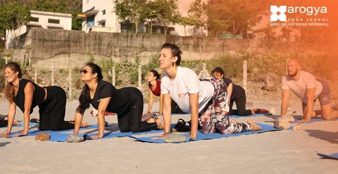 Practicing-yoga-near-river-Ganga