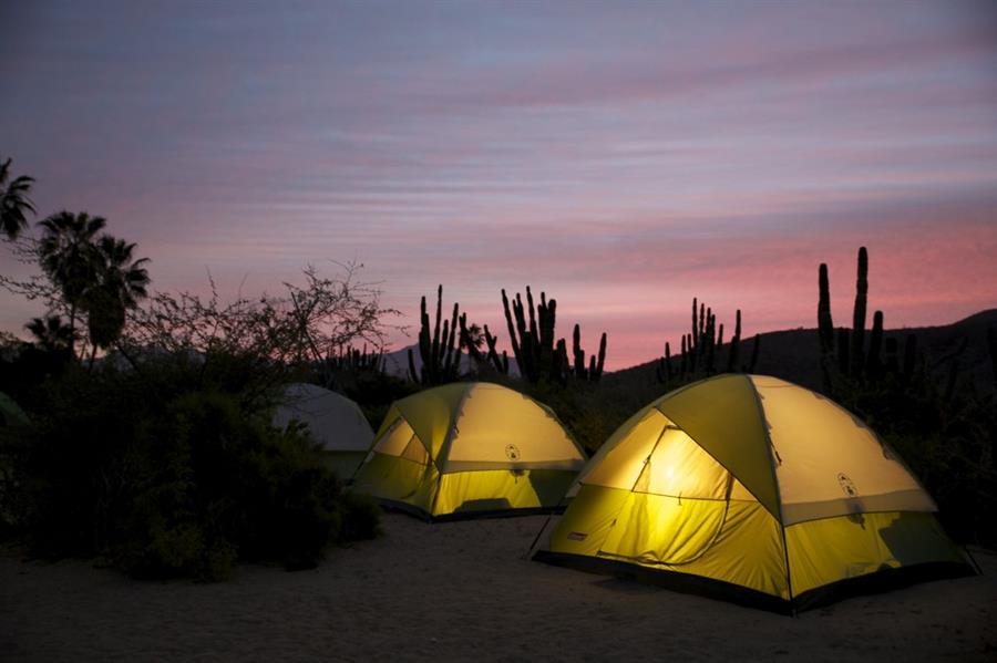 The sun rises over our fabulous furnished tents.